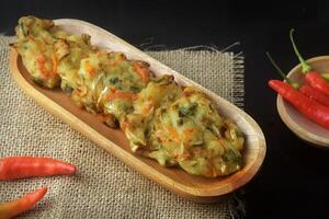 Fried food which is a mixture of vegetables and wheat flour is called Bakwan photo