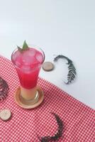 Red soda mixed with milk is a typical Indonesian drink is Soda Gembira photo