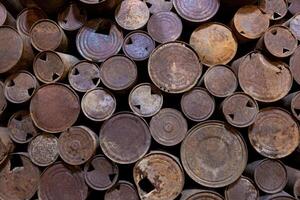 Old rusty and rusted tin cans background photo