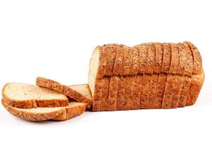 whole wheat bread with sliced grains and seeds isolated on white background photo