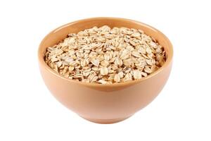 Raw organic oat flakes in ceramic bowl on portion of oats isolated on white background. Photography for packaging photo