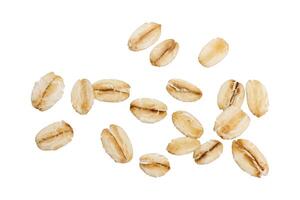 Raw organic oat flakes isolated on white background. Macro photography for packaging photo