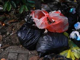 Waste that can damage the environment is often found in urban areas with poor waste management photo