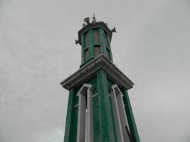 Photo of the mosque tower taken from the top floor of a multi-storey building. The mosque tower is used as a marker and also as a loudspeaker