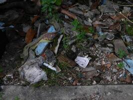 Waste that can damage the environment is often found in urban areas with poor waste management photo