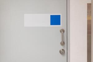 Closeup at door design, open room interior. Minimalist house style with doorknob, handle at wooden door. copy space photo