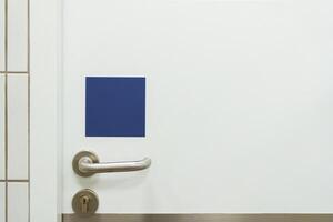 Closeup at door design, open room interior. Minimalist house style with doorknob, handle at wooden door. copy space photo