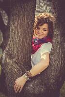 Fashion shot of a beautiful boho style girl on nature background. Boho, hippie photo