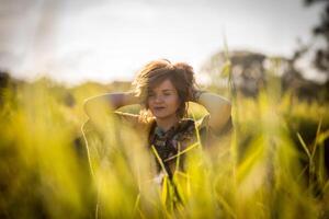 Fashion shot of a beautiful boho style girl on nature background. Boho, hippie. photo