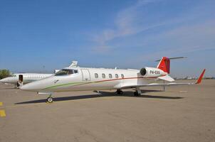 business plane parked at the airport photo