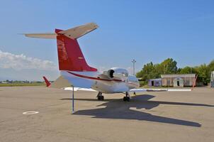 business plane parked at the airport photo