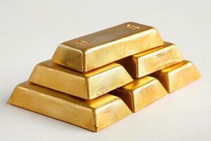 Stack of shiny gold bars on white background photo