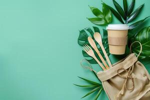 Eco-friendly reusable items on green background photo