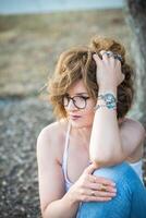 Fashion shot of a beautiful boho style girl on nature background. Boho, hippie. photo