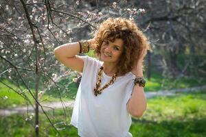 Fashion shot of a beautiful boho style girl on nature background. Boho, hippie. photo