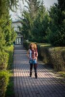 Fashion shot of a beautiful boho style girl on nature background. Boho, hippie photo