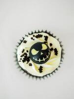halloween horror themed caupacke muffin on white background photo