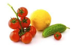 Ripe tomatoes on a branch on a white background photo