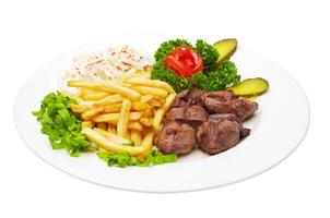 Grilled meat with fried potatoes and vegetable salad photo