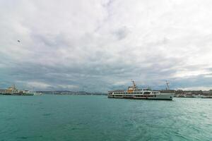 Istanbul view from Galata Bridge with Anatolian side and ferry photo