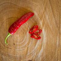 Red chilli pepper on a wooden background photo