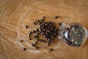 Coffee beans on a wooden table photo