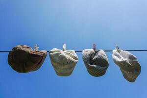 Muslim skull cap dry after washed on sunny day. Washing dirty kopiah. Peci or mulim ha photo