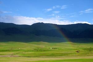 Rainbow after the storm in the mountains of Almaty region national park Assy photo