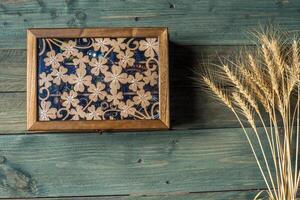 necklace and beads on a wooden background photo