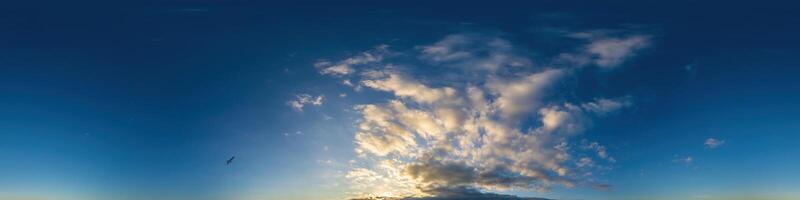 Dark blue sunset sky panorama with Cumulus clouds. Seamless hdr pano in spherical equirectangular format. Complete zenith for 3D visualization, game and sky replacement for aerial drone 360 panoramas. photo