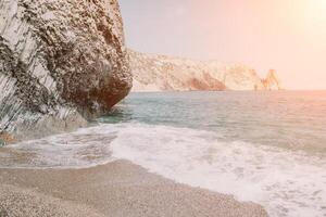 Small sea wave, Blurred Soft foamy waves washing golden sandy beach on sunset. Ocean Waves On Sandy Beach. Nobody. Holiday recreation concept. Abstract nautical summer ocean sunset nature background. photo