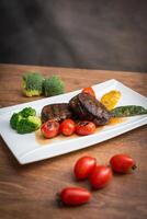 Steak on serving plate photo