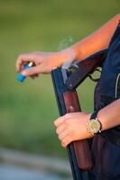 Silhouette of people with guns at sunset photo