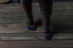 Color socks on a wooden floor photo