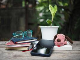 work space in garden green garden background relax and tecnology mobile photo