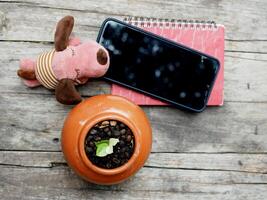 work space in garden green garden background relax and tecnology mobile photo