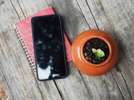 work space in garden green garden background relax and tecnology mobile photo