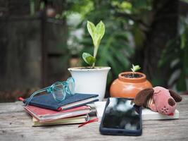 work space in garden green garden background relax and tecnology mobile photo