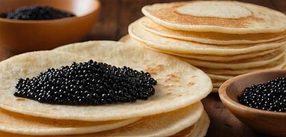 panqueques con caviar para desayuno realce lujo Mañana comida. dorado apilar de Delgado panqueques o blini coronado con negro caviar foto