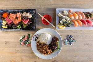 Top view of Japanese dishes. Rolls, Sashimi, Sushi. photo