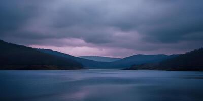 Tranquil Mountain Lake at Sunset photo