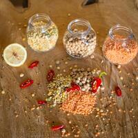 Raw cereals set on wooden background photo