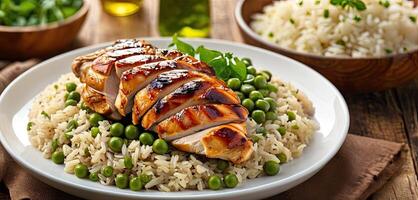 Grilled chicken, with rice and green peas served on plate, wooden rustic table background. Close-up view, grilled chicken thigh with grill marks, surrounded by rice and green peas . photo