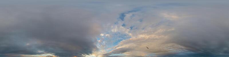 Dark blue sunset sky panorama with golden Cumulus clouds. Seamless hdr 360 pano in spherical equirectangular format. Full zenith for 3D visualization, game, sky replacement in aerial drone panoramas. photo