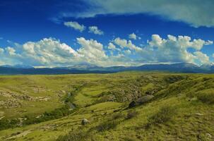 Beautiful view of valley with the mountains photo