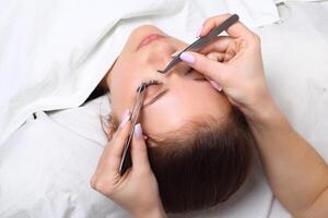 Woman Eye with Long Eyelashes. Eyelash Extension. Lashes, close up, selective focus. photo