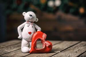 White bear doll with heart standing on old wood background. Valentine concept. photo