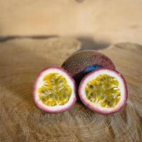 Juicy of Passion Fruit on wooden background photo