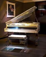 White piano with the transparent housing photo