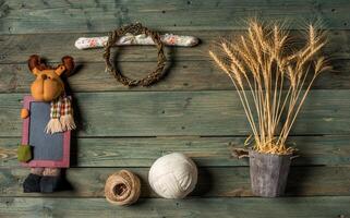 Wheat Ears on the Wooden Table. Sheaf of Wheat over Wood Background. Harvest concept. photo